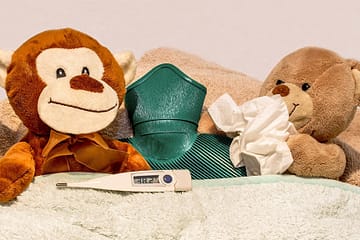 Acupunture for colds and immunity featuring stuffed animals in bed sick